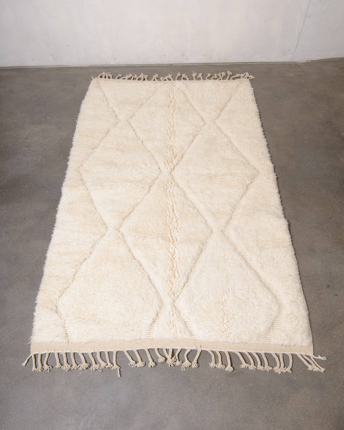 Modern, designer, handcrafted Berber rug from Morocco. Beniourain carpet with minimalist design, natural wool pile and a fluffy texture.